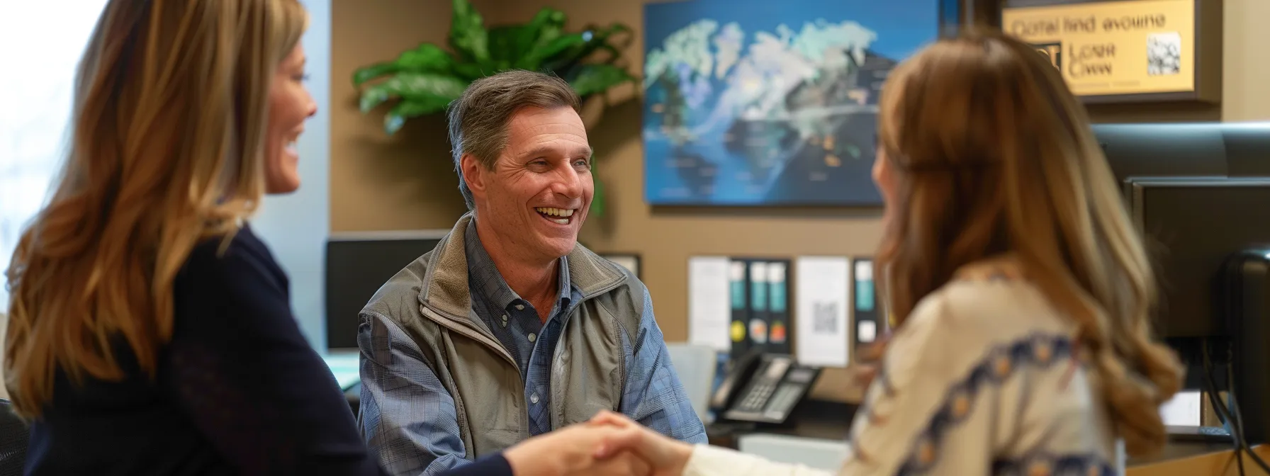 a smiling couple shaking hands with a knowledgeable mortgage broker in a cozy office setting in farmington hills.